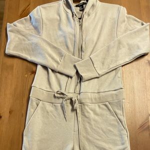 Tan sweatsuit jumpsuit. Tan Sweatsuit. Tan Jumpsuit. Sweatsuit. Sweatshirt.